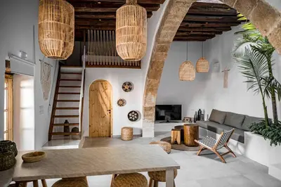 a living room with a couch and a table at CasaCarma I, privater Pool, Boho-Design, Tradition in Lachania