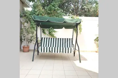 a green canopy on a patio at Family room Rhodes Greece in Ialyssos