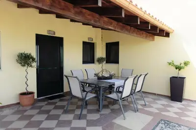 a dining room with a table and chairs at Kiparisia Villa in Phanaes