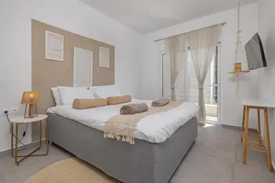 a bedroom with a large bed and a window at Villa Pastida - Private Pool & Jacuzzi & Central place in Pastida