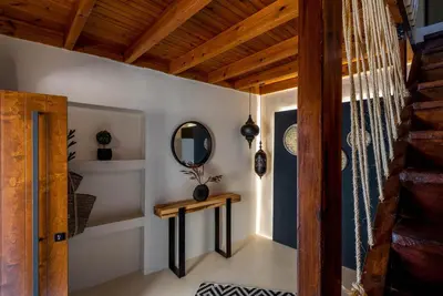 a room with a table and a mirror at Voyaz Boutique Apartments & Suites -Old Town in Rhodes Town