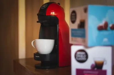 a coffee maker with a cup on a table at Voyaz Boutique Apartments & Suites -Old Town in Rhodes Town