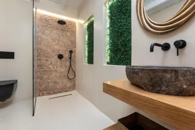 a bathroom with a sink and a mirror at Voyaz Boutique Apartments & Suites -Old Town in Rhodes Town