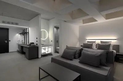 a living room with a couch and a table at Essence Suites Downtown Suites - Adults Only in Rhodes Town