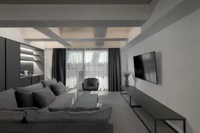 a living room with a couch and a chair at Essence Suites Downtown Suites - Adults Only in Rhodes Town