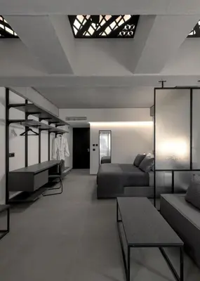 a room with a bed and a couch and a table at Essence Suites Downtown Suites - Adults Only in Rhodes Town
