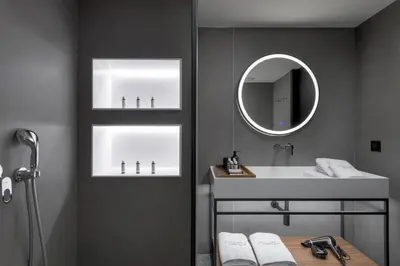 a bathroom with a sink and a mirror at Essence Suites Downtown Suites - Adults Only in Rhodes Town