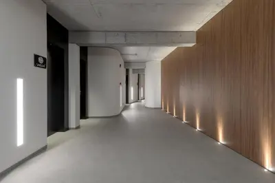 an empty hallway in a building with wooden walls at Essence Suites Downtown Suites - Adults Only in Rhodes Town