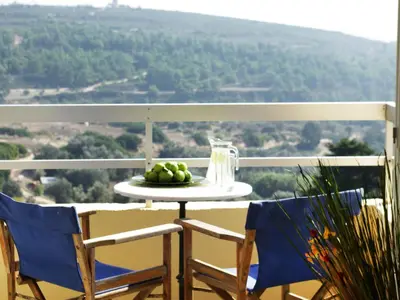 a plate of fruit on a table on a balcony at Thomas Hotel in Monólithos