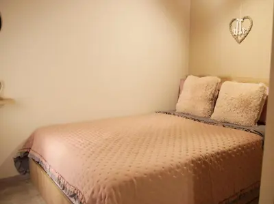 a bedroom with a bed with two pillows at AFANDOU NANA'S HOUSE in Afantou