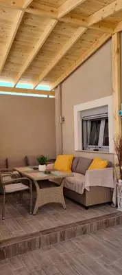 a living room with a couch and a table at AFANDOU NANA'S HOUSE in Afantou