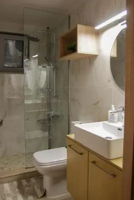 a bathroom with a toilet and a sink and a shower at AFANDOU NANA'S HOUSE in Afantou