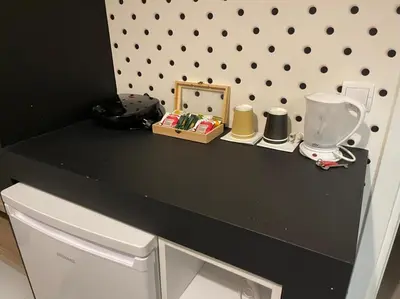 a black counter top with a blender on it at Jz Plus Picasso in Rhodes Town