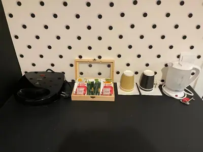 a table with a mirror and other items on it at Jz Plus Picasso in Rhodes Town