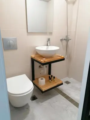 a bathroom with a sink and a toilet at Jz Plus Picasso in Rhodes Town