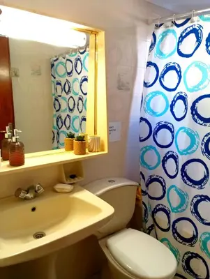 a bathroom with a toilet and a sink and a mirror at Villa Stella Family House in Pefki Rhodes