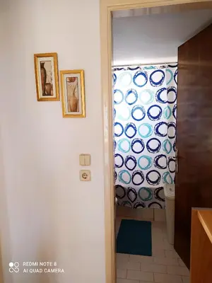 a bathroom with a shower door with a window at Villa Stella Family House in Pefki Rhodes