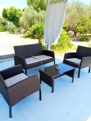 a group of patio furniture and a coffee table at Villa Stella Family House in Pefki Rhodes