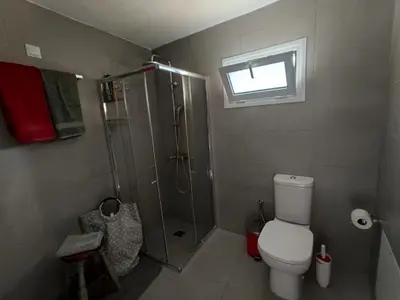 a bathroom with a shower and a toilet at ILAKATI House, Megalo Horio village, Tilos Island in Megálon Choríon