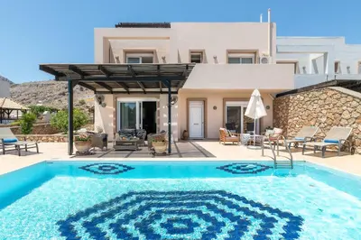 a swimming pool in front of a villa at Lindos Villa Fadia with Private Pool in Líndos