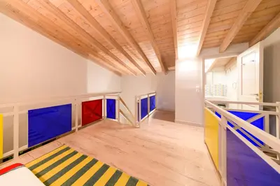 a room with colorful floors and a wooden ceiling at Aphrodite Villas Halki - Villa Bougainvillea in Halki