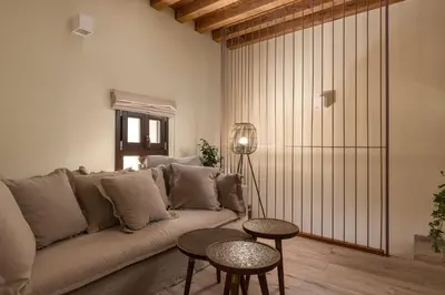 a living room with a couch and two tables at San Antonio Luxury Apartments, Medieval Town in Rhodes Town