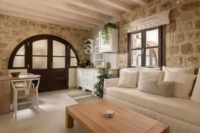 a living room with a couch and a table at San Antonio Luxury Apartments, Medieval Town in Rhodes Town