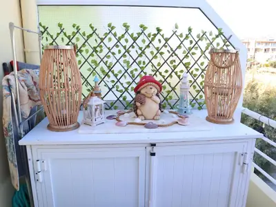 a table with two lamps and a doll sitting on it at Summer Lovin in Haraki