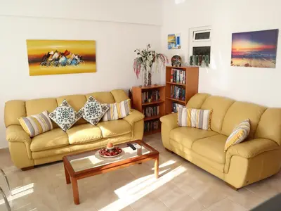 a living room with two couches and a coffee table at Summer Lovin in Haraki