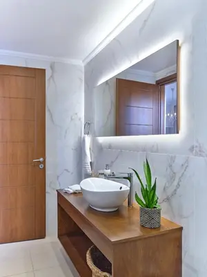 a bathroom with a sink and a mirror at Chrissiida Villa in Ialyssos