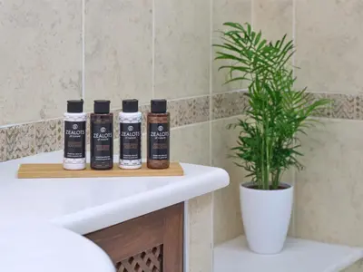 three bottles of hair products sitting on a bathroom counter at Chrissiida Villa in Ialyssos