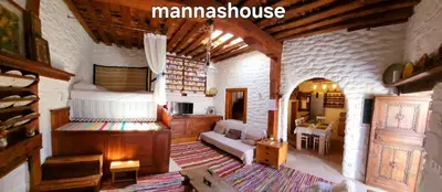 a living room with a large room with a house at Mannashouse in Émbonas