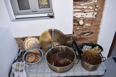 a group of pots and pans on top of a stove at Mannashouse in Émbonas