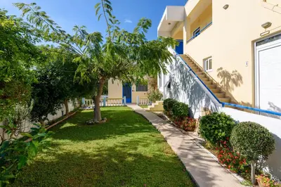 a garden in front of a building at Litsas Studios in Phanaes