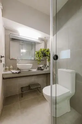 a bathroom with a sink and a toilet and a mirror at Manolis Loft Apartment, Rhodes Town in Rhodes Town
