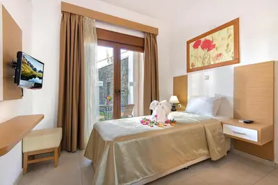 a hotel room with a bed and a window at Holiday home in Kiotari near the beach in Kiotari