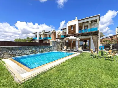 a house with a swimming pool in the yard at Holiday home in Kiotari near the beach in Kiotari