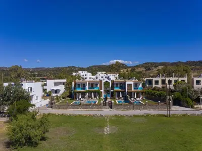 arial view of a building with a resort at Holiday home in Kiotari near the beach in Kiotari