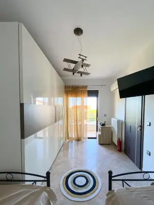 a living room with a bed and a ceiling at Rosalia House in Rhodes Town