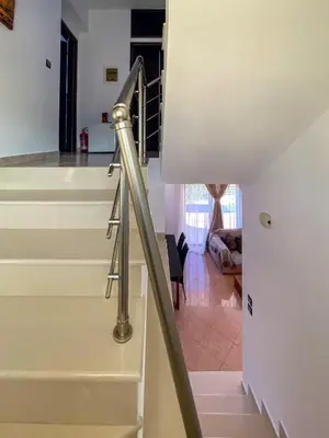 a metal stair hand rail in a room with a staircase at Rosalia House in Rhodes Town
