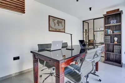 an office with a desk with two laptops on it at Sia Mare Residence in Faliraki