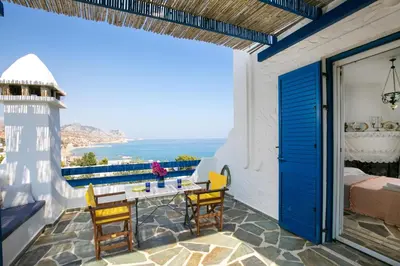 a balcony with a view of the ocean at Nefeli house in Archangelos