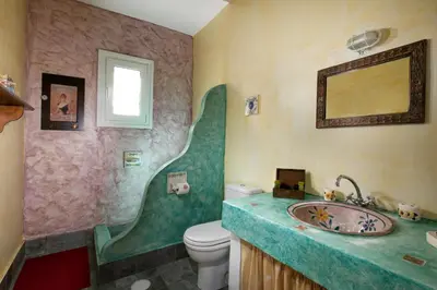 a bathroom with a sink and a toilet at Nefeli house in Archangelos