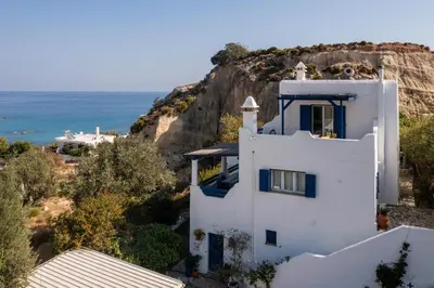 a white house with a view of the ocean at Nefeli house in Archangelos