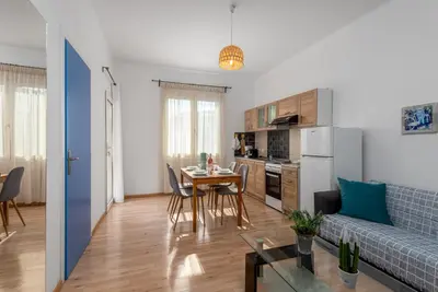 a living room with a couch and a table at Rhodes Central Apartment in Rhodes Town