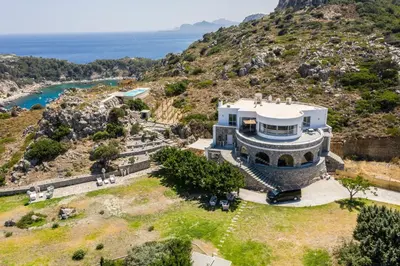 an aerial view of a house on a hill at Pristine Seaview Villa , with 5-Star Resort Access in Faliraki