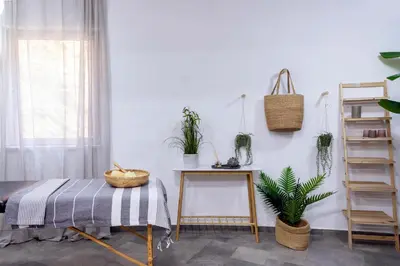 a room with a table and potted plants at Pristine Seaview Villa , with 5-Star Resort Access in Faliraki