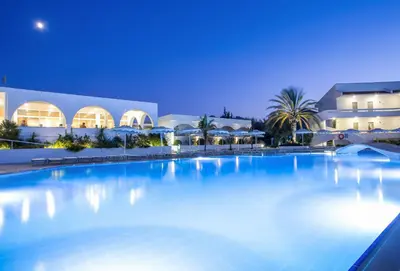 a large swimming pool in front of a building at Niriides Hotel in Kolimbia