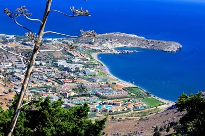 an aerial view of a village next to the ocean at Niriides Hotel in Kolimbia