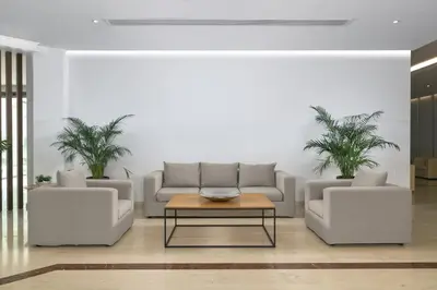 a living room with two couches and a coffee table at Niriides Hotel in Kolimbia